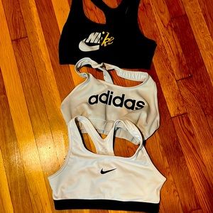 Black Nike and addidas are a size M. White Nike is a size XL in girls.